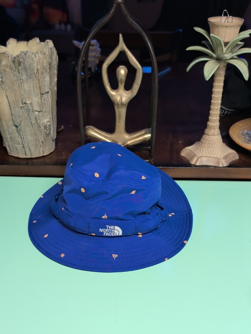 The North Face Blue Bucket Hat with Tiny Orange Floral Dots